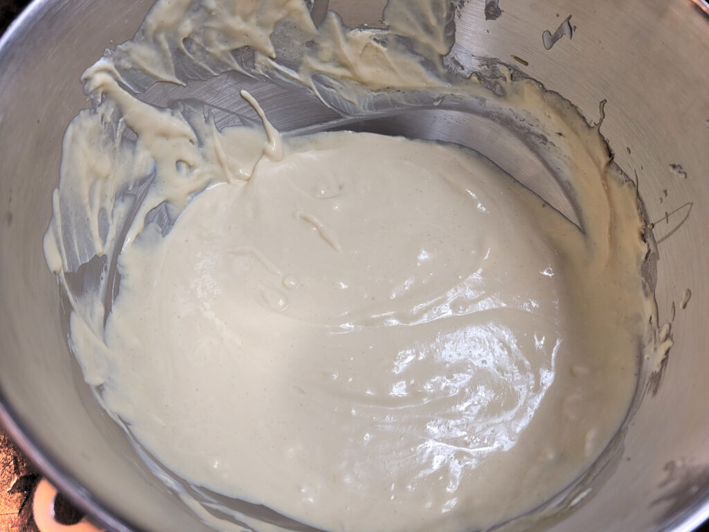 cheesecake batter in stainless steel stand mixer bowl