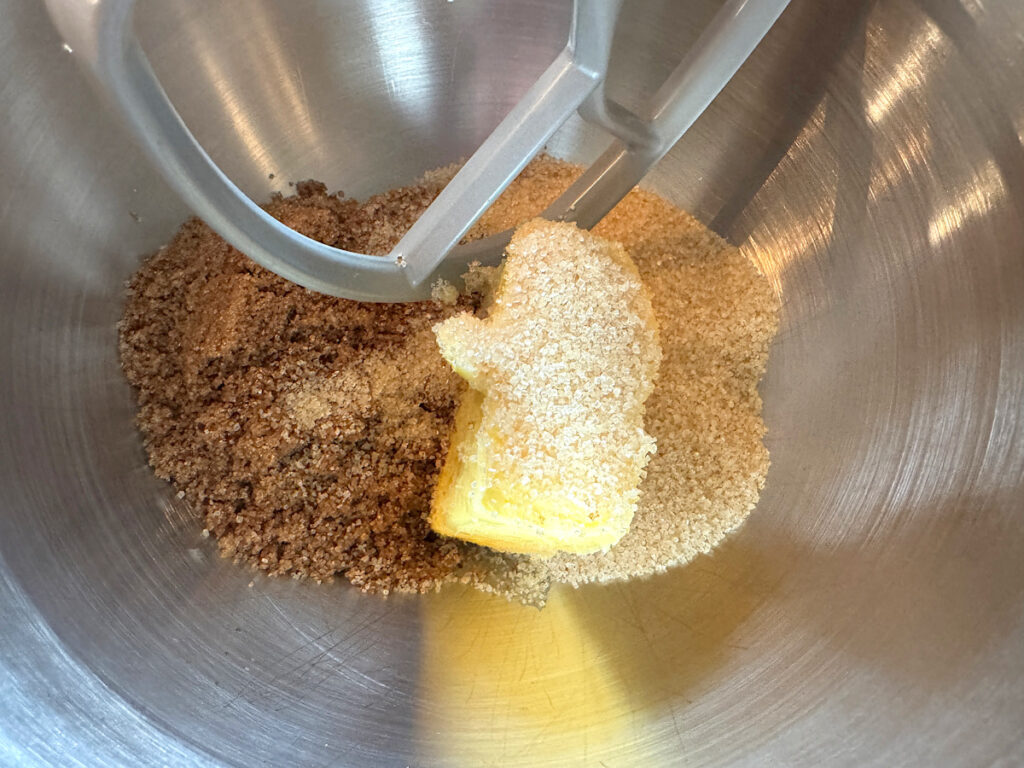 butter and sugar in a stainless steel mixing bowl