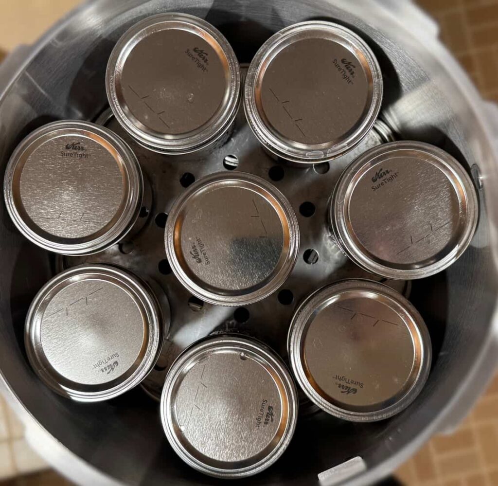 top view of 8 jars in a pressure canner