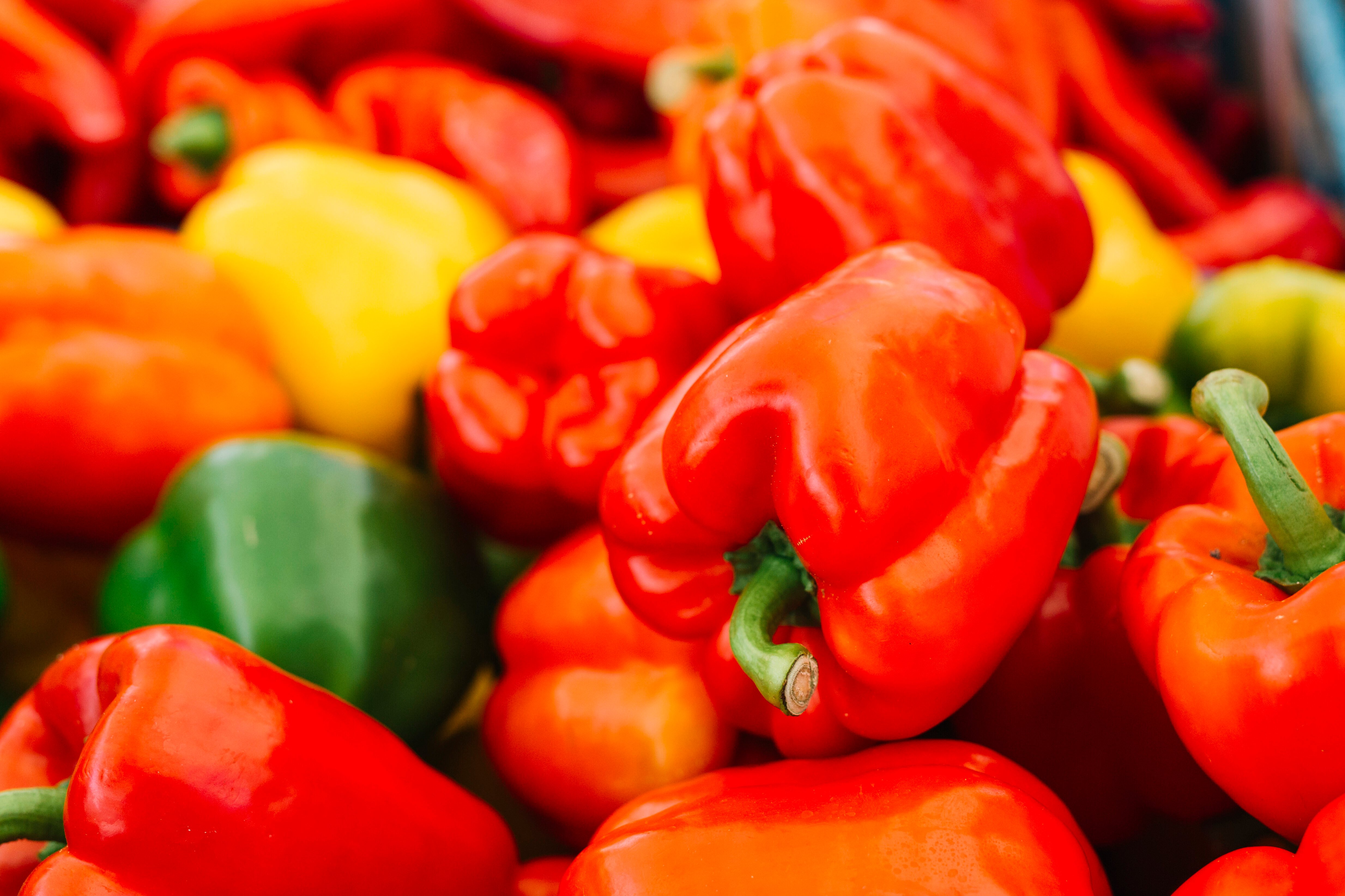 pile of red, yellow, and green bell peppers